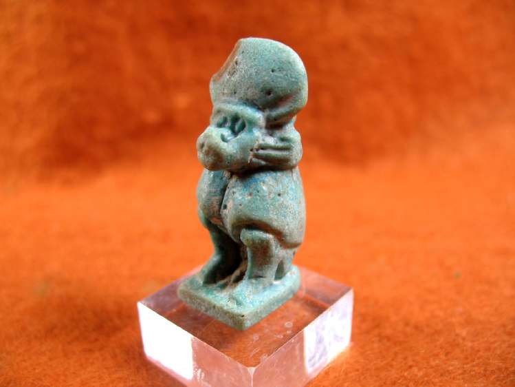 4289. Good faience amulet of Thoth as seated baboon