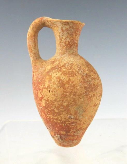6089. A  small early Canaanite red slipped "Abydos ware" juglet