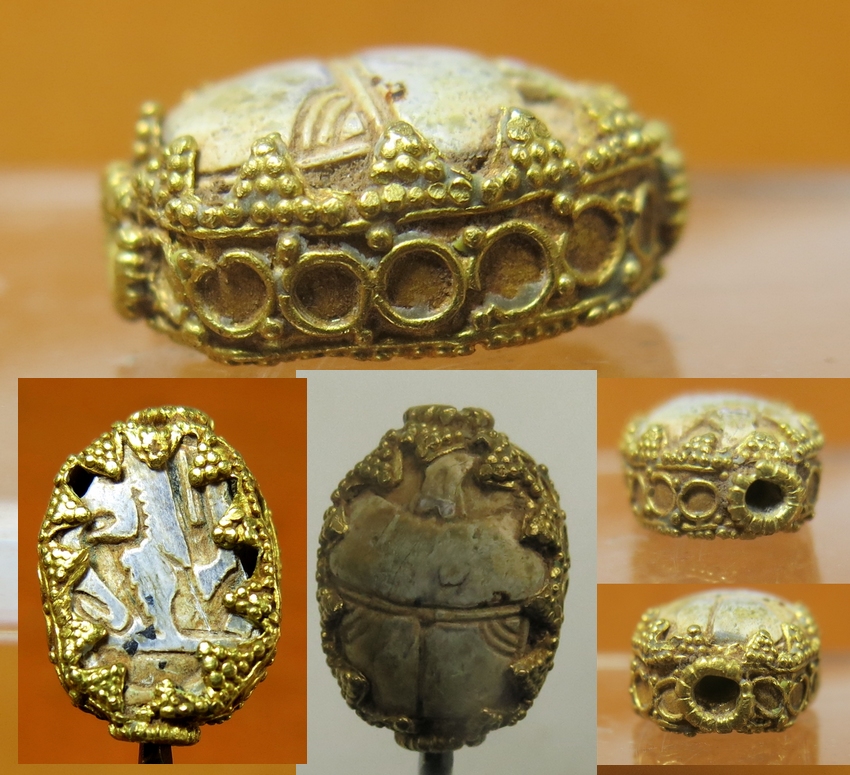 6113. Interesting scarab mounted in delicate gold frame.