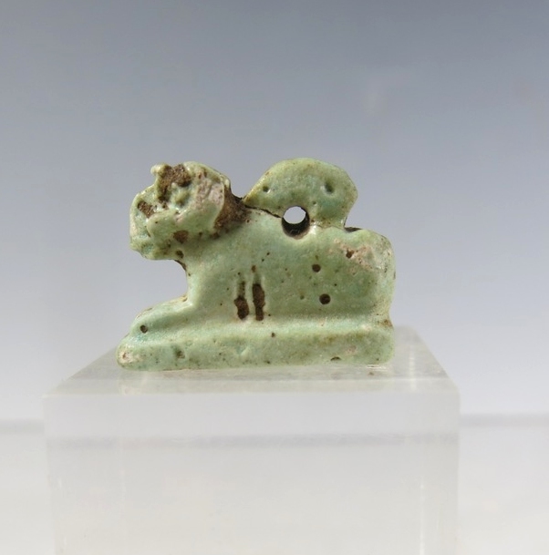 6128. Recumbent faience Ram amulet of Khnum