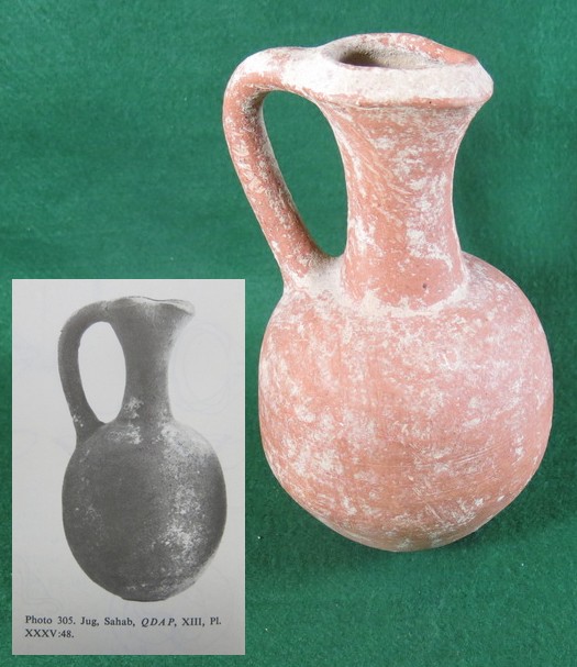 6065. RARE Ammonite Redware jug