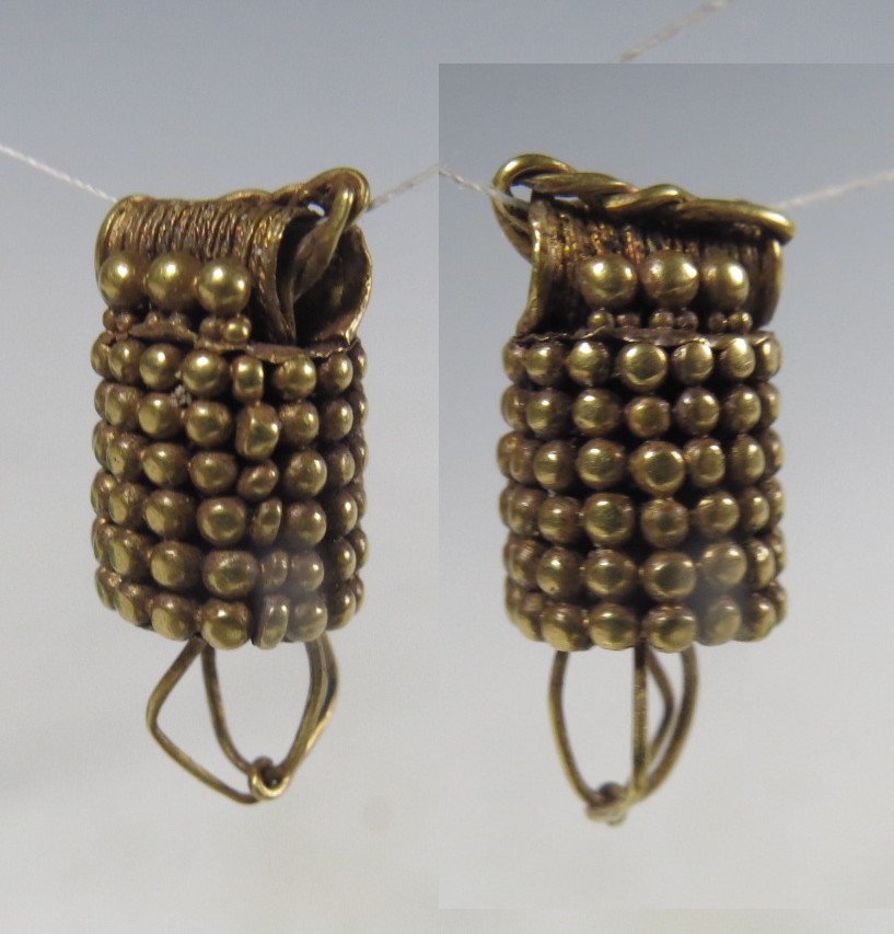 6023. Solid gold element from a Parthian gold earring