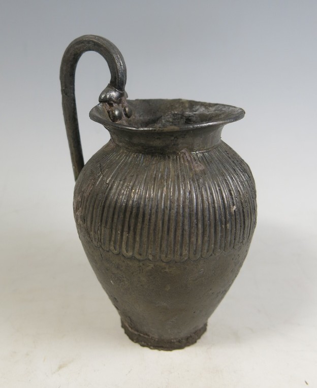 6063. An Archaic East Greek silver oinochoe.