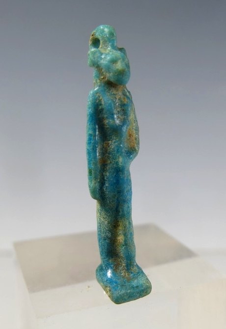 6120.  Tall slender Sekhmet amulet holding Wadj sceptre