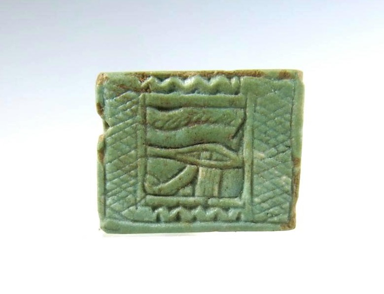 4938. A fine blue faience Wedjat plaque