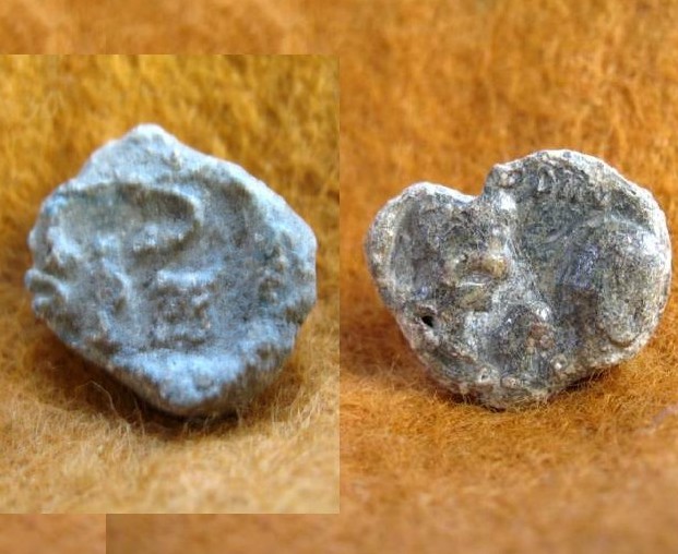5857. A pair of Roman lead sealings