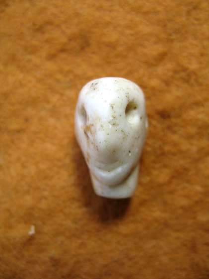 4459.  Stone amulet of the head of the demon Pazuzu
