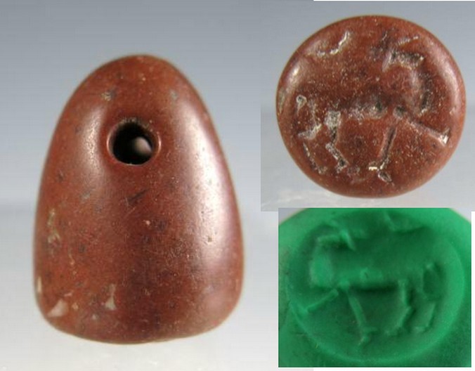 5183. **SOLD**  Attractive red stone Neo-Assyrian stamp seal