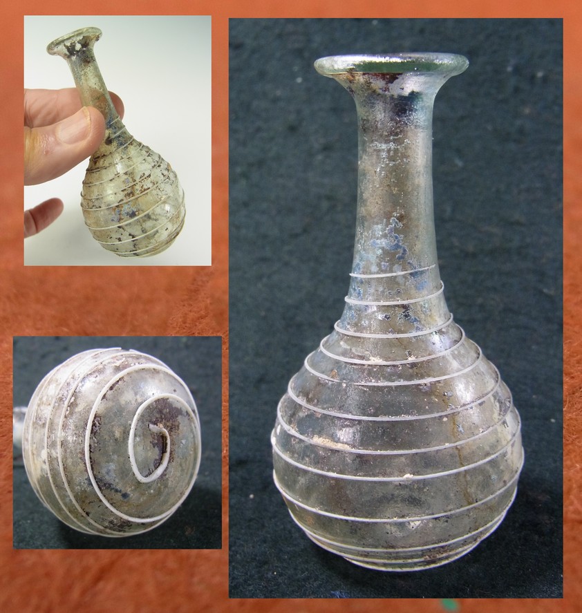 4987. **SOLD**  First century Roman glass bottle with applied trailing